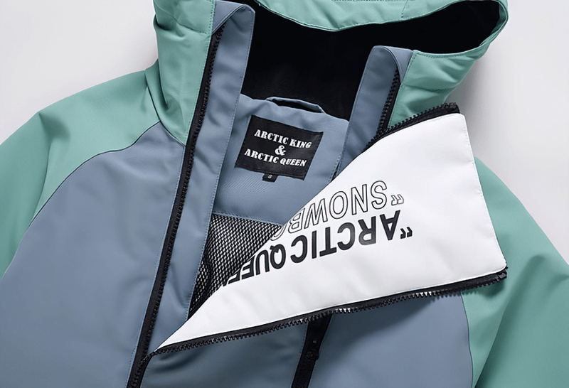 Warm waterproof snowboarding jacket with double zipper in blue and green, featuring hooded collar for skiing.